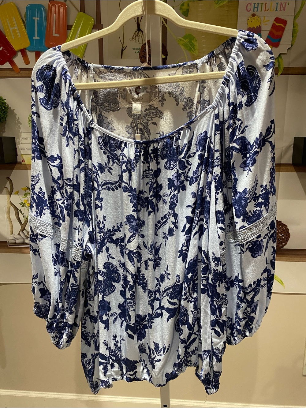 Cupio light and Navy Floral Off-Shoulder Peasant Top 2 X. Ptp is 27 length 28.